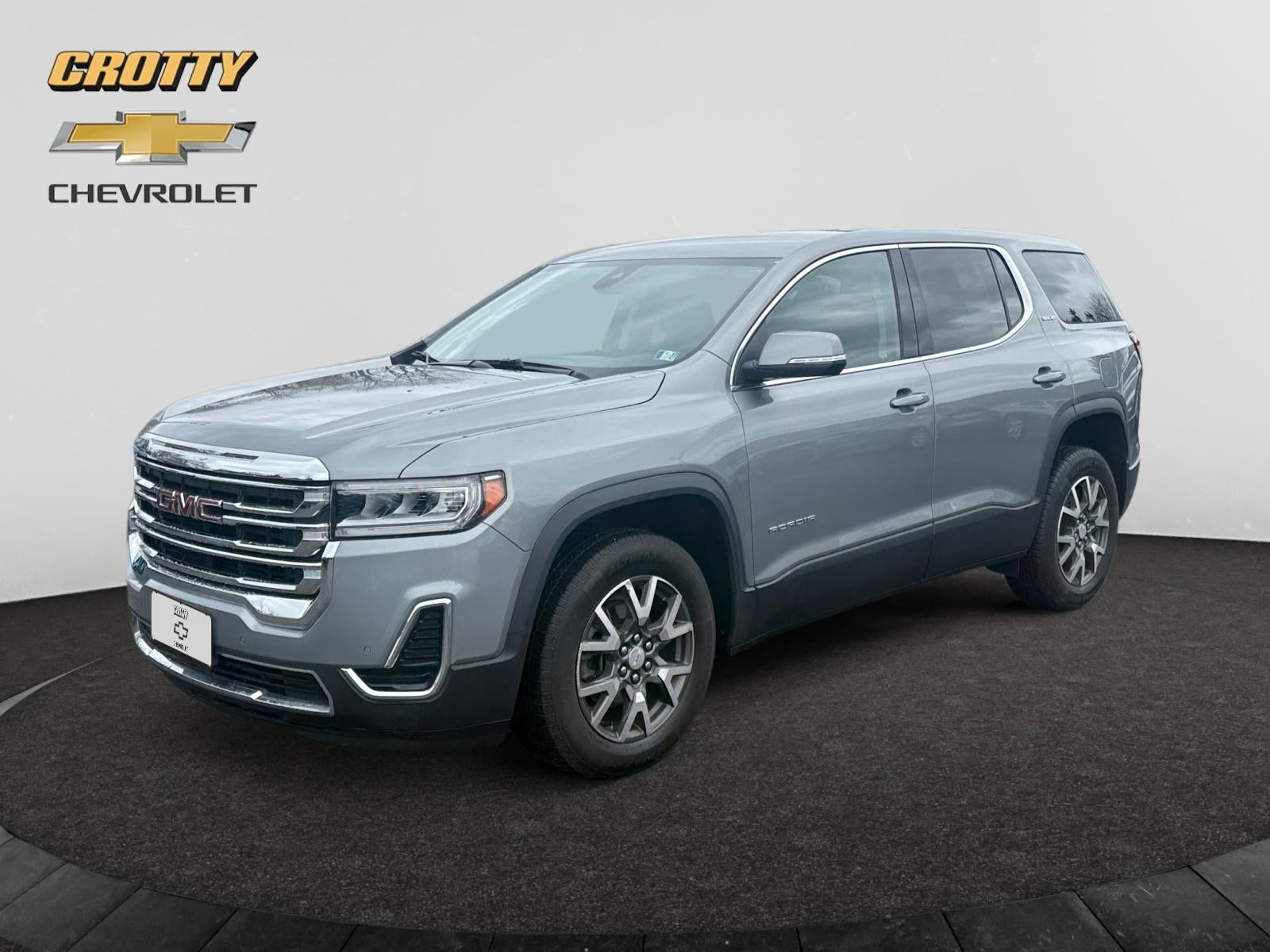 2023 GMC Acadia SLE in Sterling Metallic — front three-quarter view